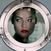 a woman looking out of a porthole