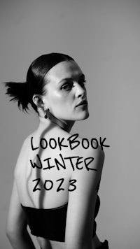 a black and white photo of a woman with the words lookbook winter 2012